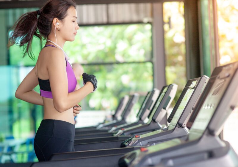 girl running on the treadmill in the gym