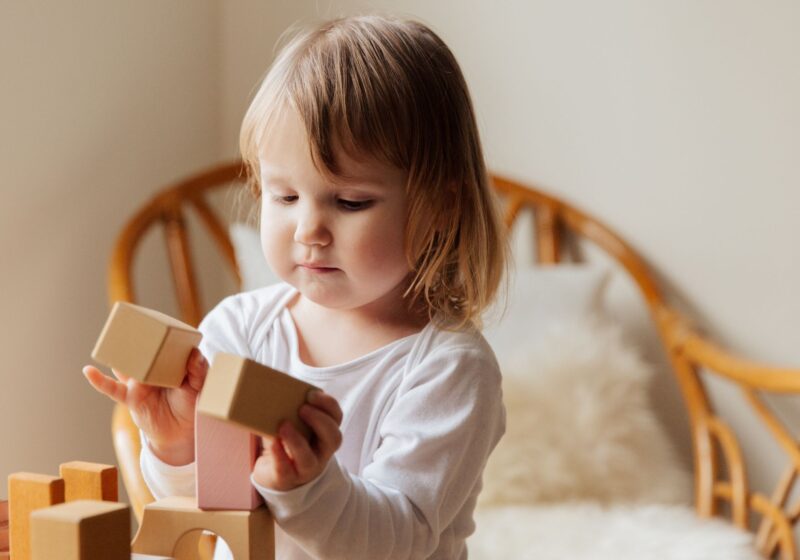 child playing with bricks